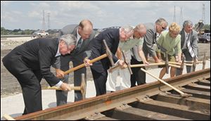 At the dedication were, from left, county Commissioner Pete Gerken, the Port Authority’s
Paul Toth and James Tuschman, Midwest Terminals’ Fred Deichert and Alex Johnson, Rep. Marcy Kaptur, and Lucas County Improvement Corp.’s Ford Weber.
