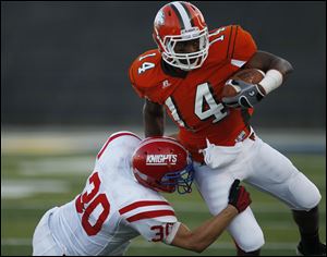 Allen Gant of Southviwe tries to shake Michael Wagner of St. Francis in Friday night’s season opener at the Glass Bowl. The Cougars outgained the Knights 333-232 in total yardage.