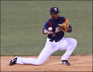 The Mud Hens’ Audy Ciriaco makes a play at shortstop for the Mud Hens. It was the first time in his life that he and his brother, Pedro, have played against each other.