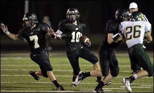 Perrysburg's Corey Griffith runs the ball for big yardage. The Jackets have opened with two victories.