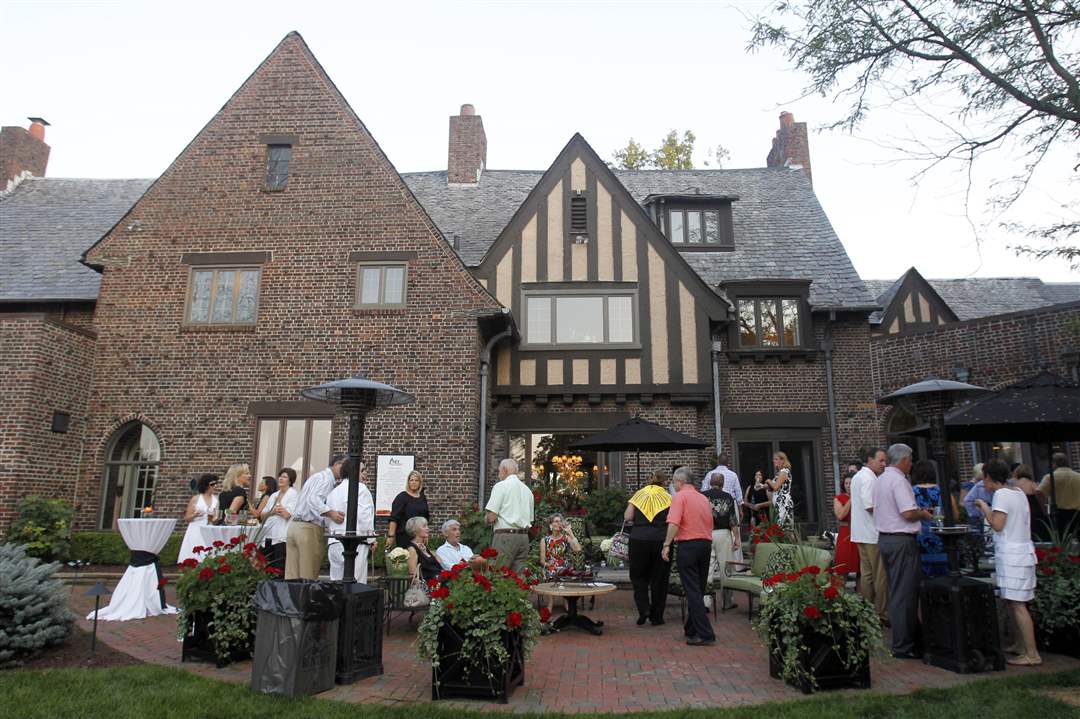 Guests-enjoy-the-back-patio-at-Art-and-Autism-charity-event