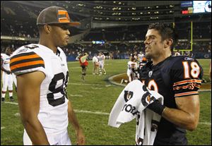 Dane Sanzenbacher, right, talks with former Ohio State teammate Brian Robiskie after the Bears beat the Browns in the preseason.
