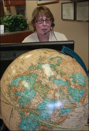Travel agent Mary Gillingham of Central Travel in Sylvania remembers trying to help stranded travelers return home after flights were grounded on 9/11.
