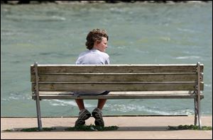 Nick Wetzel, who was on vacation with his family from Cincinnati, watches the activities on Lake Erie on August 3, 2009.