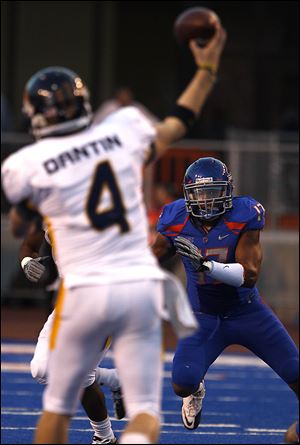 Toledo's Austin Dantin is stared down by Boise State's Winston Venable in the first half of last season's contest at Boise State. UT lost 57-14 then. The No. 4 Broncos play at the Glass Bowl this time around.