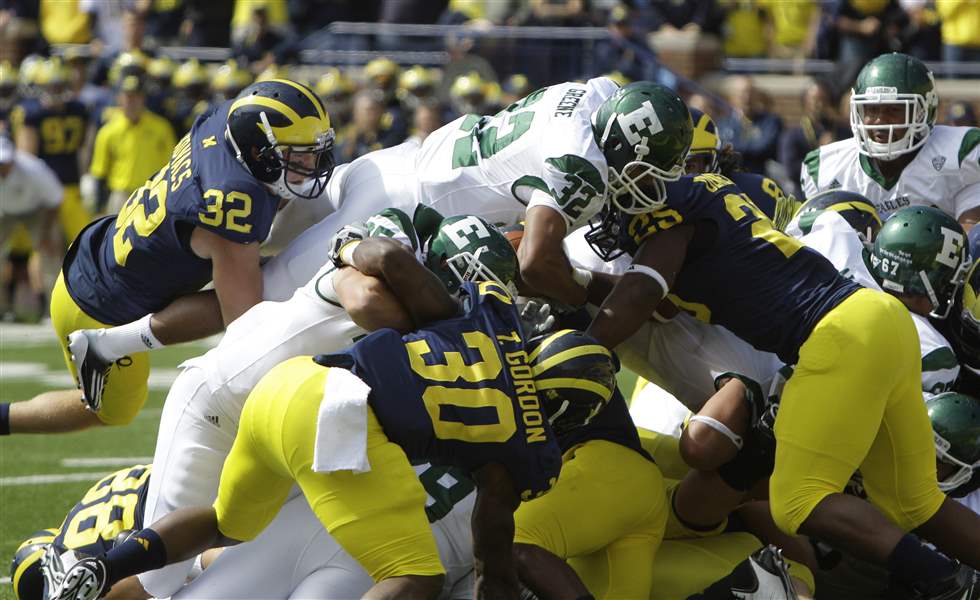 Jordan-Kovacs-Dominique-Sherrer-Kenny-Demens-Wolverines-defense