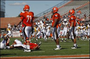 Stunned Bowling Green players react after an extra-point attempt was blocked against Wyoming.