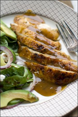 Honey-thyme glazed chicken with cider gravy and baby spinach.