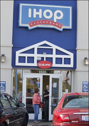 A Lucas County sheriff's deputy turns a customer away from the IHOP restaurant on Airport.