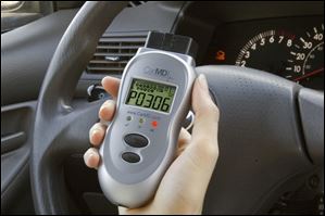 CarMD has created a hand-held diagnostic gadget that plugs into a car's computer to monitor sensors, brakes and safety systems, and let you know just what might have caused a light to go on.