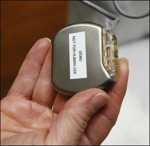 When the device detects an indication of a heart attack, it will vibrate and activate a pager the patient carries.
