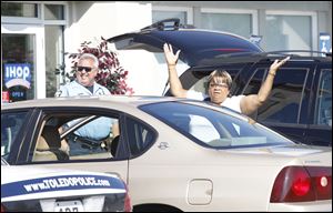 Donna Logan throws her arms in disgust when turned away from IHOP on Talmadge due to their closing for a federal investigation on September 20, 2011.