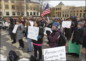 Protesters demonstrate against Ohio Senate Bill 5 on the Bowling Green State University campus in Bowling Green in this March 3, 2011, file photo.