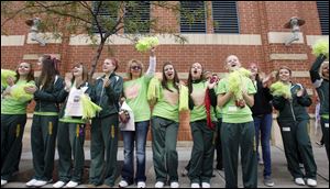 Start High School cheerleaders keep the spirit high as they encourage the estimated 17,000 runners and walkers in the 5K Komen Northwest Ohio Race for the Cure downtown.