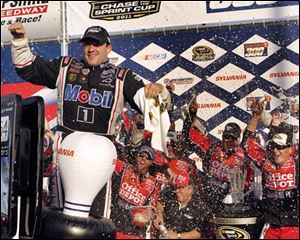 Tony Stewart celebrats with his crew in Victory Lane after winning the NASCAR Sprint Cup Series auto race at New Hampshire Motor Speedway on Sunday in Loudon, N.H. 