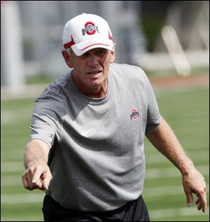 In this Aug. 8, 2011, photo, Ohio State running backs coach Dick Tressel points during NCAA college football practice in Columbus, Ohio.