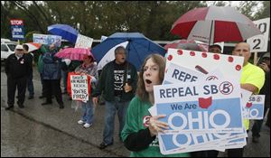 Attendees of the event were met with protestors of Issue 2, such as Jean Ford of Toledo, outside the Bancroft Street venue.