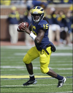 Michigan quarterback Denard Robinson (16) looks to pass during the second quarter of a college football game against Minnesota in Ann Arbor, Mich., Saturday.