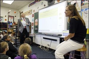 Lynn Cherry speaks to her Woodland Elementary fourth-graders during Perrysburg Mayor Nelson Evans' visit.