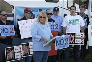 Sandy Coutcher of Whitehouse speaks against State Issue 2 during a We Are Ohio bus tour stop in Toledo, Wednesday, October 5, 2011.  She is a work specialist with the Lucas County Board of Developmental Disabilities.  The We Are Ohio organization was demonstrating against Issue 2 and in favor of early voting in Ohio.