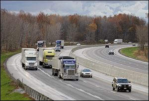 Traffic on the Ohio Turnpike passes through Olmsted Falls, Ohio. Ohio congressman are considering leasing the Ohio Turnpike to a private operator.