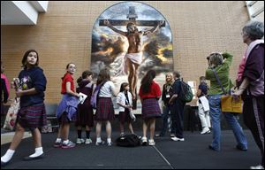 Students from The Immaculate Heart of Mary talk with Mia Tavonatti of Santa Ana, Calif. while looking at her stained glass mosaic, 