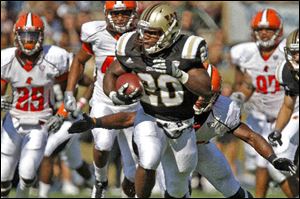 Western Michigan University's Brian Fields runs away from the  Bowling Green defense during the game at Waldo Stadium in Kalamazoo, Michigan, Saturday.