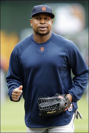 Detroit Tigers' Delmon Young jogs on the field before Game 2 of baseball's American League championship series against the Texas Rangers Monday.