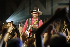Hank Williams Jr. performs during the recording of a promo for NFL Monday Night Football in Winter Park, Fla. Williams recorded the promo even though the upcoming season still remains in limbo.