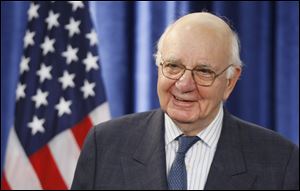 Former Federal Reserve Chairman Paul Volcker, chairman-designate of the  Economic Recovery Advisory Board, listens to President-elect Barack Obama as he speaks during a news conference in Chicago.