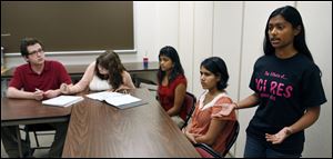 Senior Smriti Gupta, standing, practices a presentation for the international competition in the U.S. District Court for the Eastern District of New York. The school's team competed last year and lost to teams from Colorado and Florida that were among the top 15 in the country.