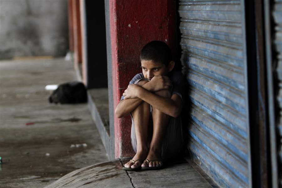 Manzanillo-Mexico-boy-rain-shelter