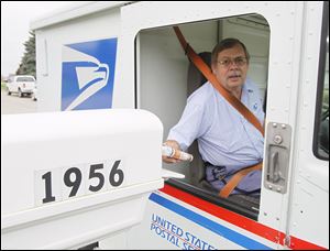 Randy Warner delivers mail on Lear Drive in Northwood. His career with the postal service has provided him with a collection of stories.  He says he doesn't plan to retire for a few more years. 