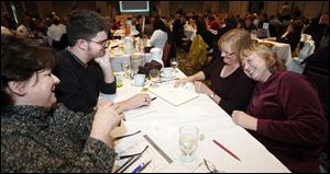 Left to right Sandy Norton, Todd Huss, Alma Reising, and Veronica Hughes of Root Learning win the 24th annual Blade Corporate & Community Spelling Bee Thursday at the Park Inn in Toledo.