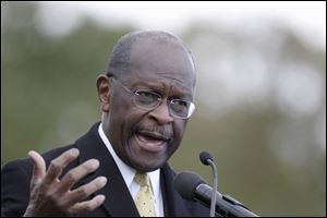 Republican presidential candidate, Herman Cain addresses the crowd during a campaign stop in Detroit.