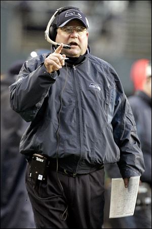 Browns president Mike Holmgren now appears on the sideline before the game in a suit and tie. With the Seahawks, above right, he was coaching when Seattle went to the Super Bowl in February, 2006. The Seahawks lost that game in Detroit to the Steelers.