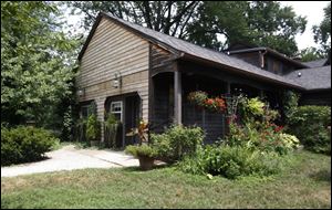 The cost of converting the garage 11 years ago was $25,000. It has a separate entrance and full kitchen and is wheelchair accessible. 