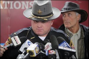 Muskingum County Sheriff Matt Lutz appears with Jack Hanna at a news conference. The sheriff ordered his deputies to kill the animals in order to protect the public.