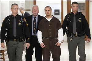 Cameo Pettaway is taken back to jail following his initial hearing in Lucas County Common Pleas Court last Thursday.