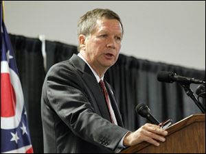 Governor John Kasich speaks Thursday at a press conference announcing the approval of a deal with the Toledo Port Authority and BX Solutions at Toledo Express Airport.