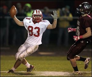 Eastwood's Alex Keyes  (83) scores a touchdown against Genoa.