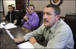 Commissioners from left, Ben Nutter, Dave Sauber, and Jeff Wagner, speak to the media following presentations from Seneca County courthouse  preservationists in Tiffin, Tuesday.