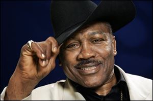 In this April 2009, file photo, Joe Frazier poses for a portrait in New York. The former heavyweight champion has died after a brief final fight with liver cancer. He was 67. 