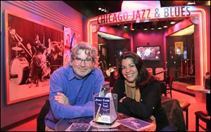 Kelly Leonard, left, vice-president at the Second City comedy club and Liz Garibay with the Chicago History Museum, sit within a display highlighting Chicago's Jazz and Blues history at the museum in Chicago. Second City, famed for its parody and improvisation, has partnered with the museum to turns its wit on Chicago itself. 
