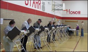 Residents of Oregon's 12th precinct cast their voter Tuesday at Starr Elementary School. 