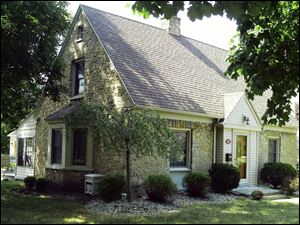 This New England stone Cape Cod house, at 704 Ansonia St., built in 1924, is on the Holiday Home Tour featuring Old Eastmoreland scheduled for Dec. 3 and 4.