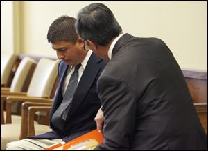 Rodney Lewis speaks with his attorney Jerry Phillips, after his sentencing.
