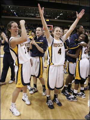 UT's Courtney Ingersoll, left, and Naama Shafir celebrate their victory over Syracuse during the 2nd round of WNIT at Savage Arena in Toledo.