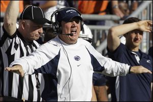 Penn State defensive coordinator Tom Bradley yells from the sidelines during an Oct. 8 football game against Iowa in State College, Pa.