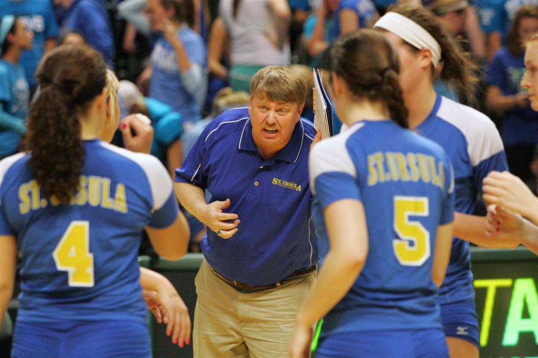 St-Ursula-coach-John-Buck-gives-his-team-a-pep-talk